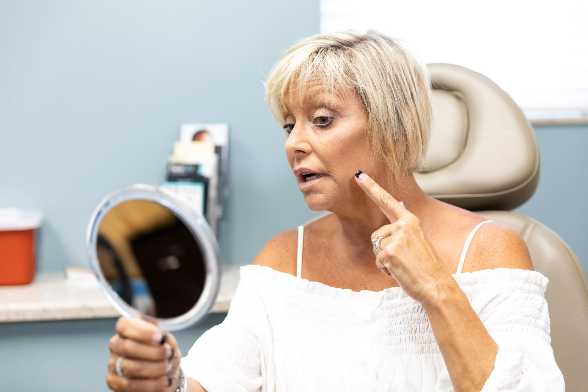 woman looking into a mirror