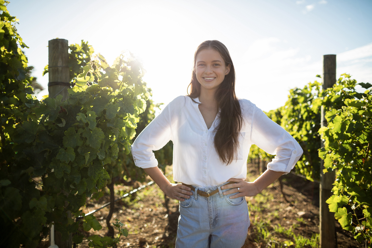 Portrait of smiling woman at vineyard