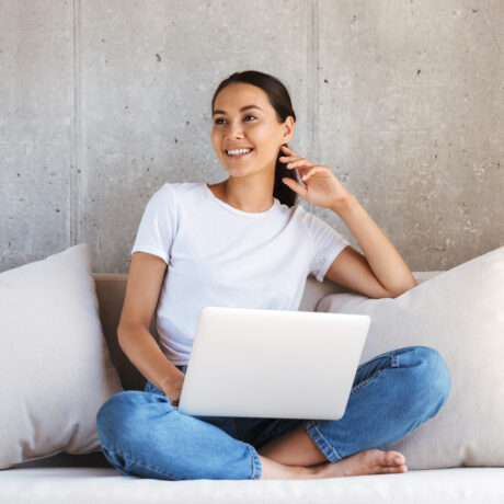 Pretty young asian woman using laptop computer