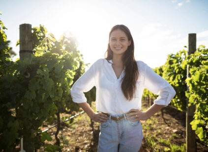 Portrait of smiling woman at vineyard