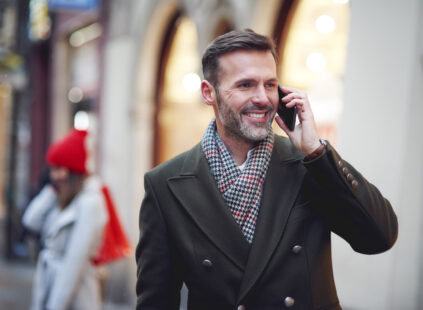 Smiling man is on the phone